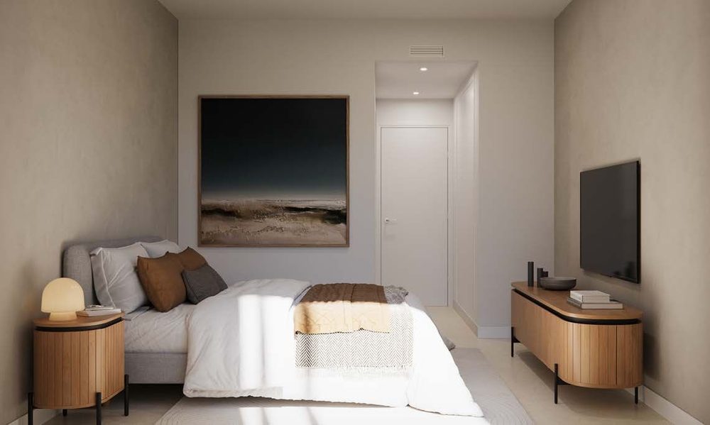 Schlafzimmer mit Fernseher und Sideboard